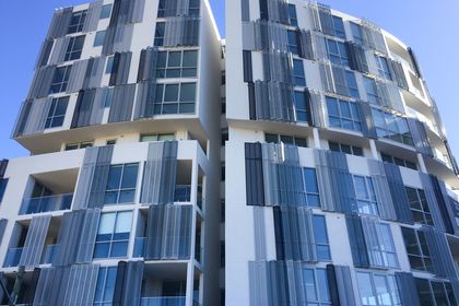Arrow Metal's shutter facades at Infinity apartments