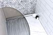 Tile-over stainless steel shower tray