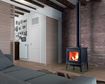 Hergom's E-30M freestanding fireplace features a traditional design on solid cast iron legs.